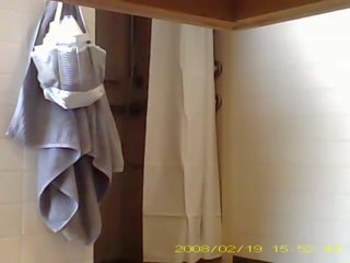 Spying fascinating 19 year old Ms showering in dorm bathroom